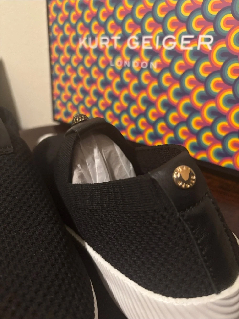 Kurt Geiger Black Knit Slip-On Sneakers with Gold Emblem